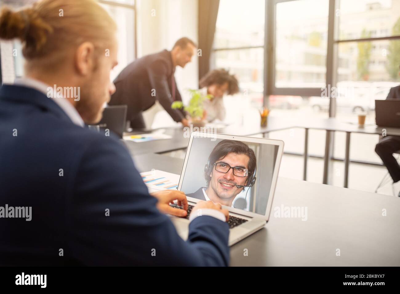 Businessman is working in remote with a videocall due to quarantine of coronavirus covid19. Concept of smart working Stock Photo