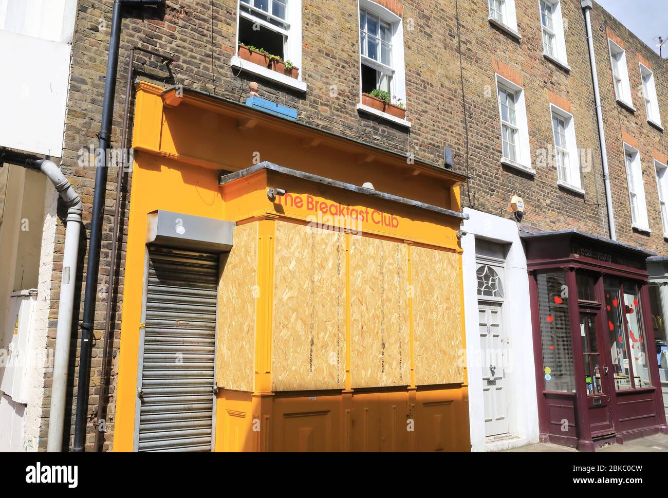 The usually popular Breakfast Club cafe on Camden Passage, boarded up, in Islington, north London, boarded up during the coronavirus pandemic lockdown, UK Stock Photo