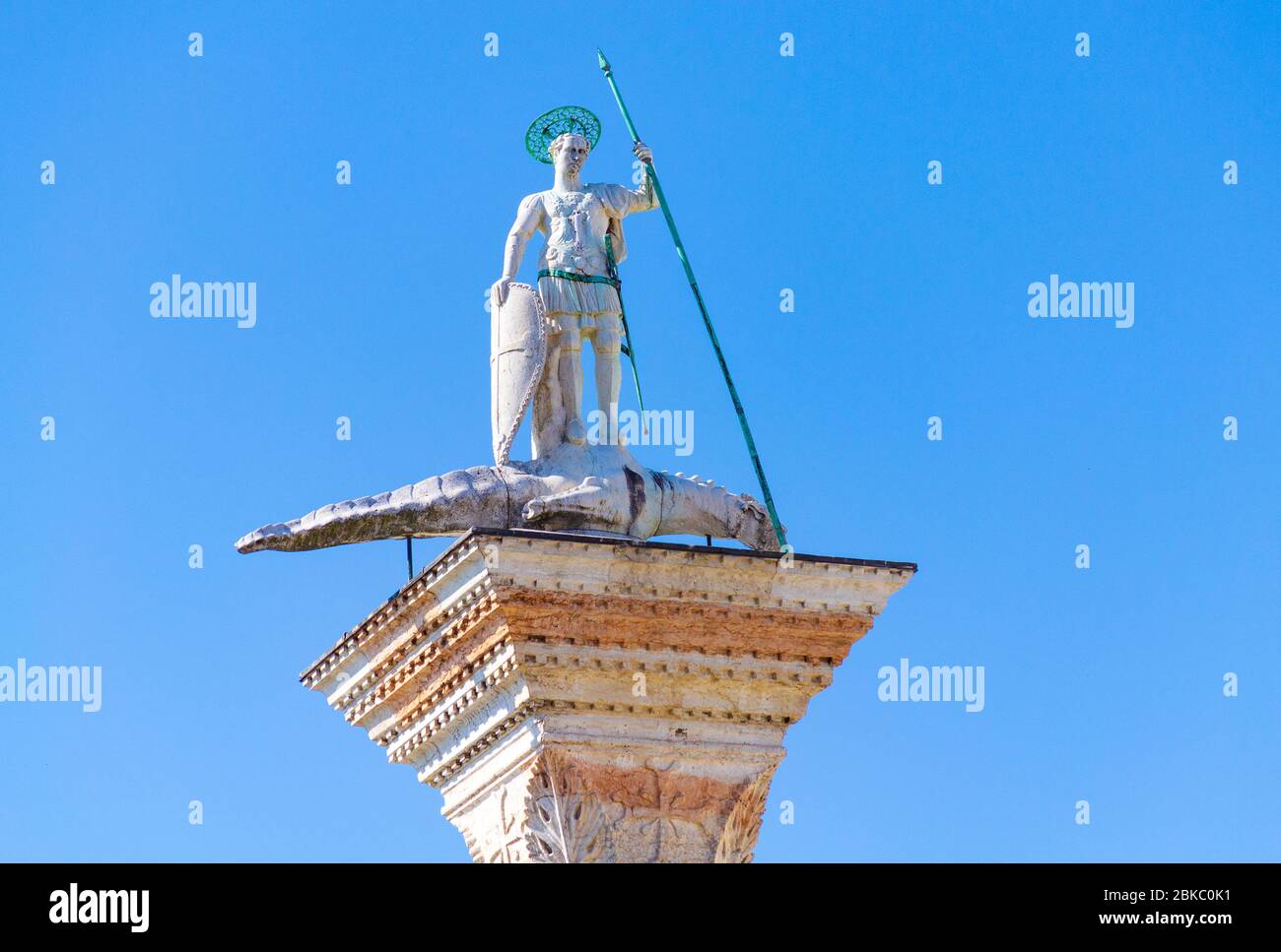 the granite column top carrying one of symbols of the two patron saints