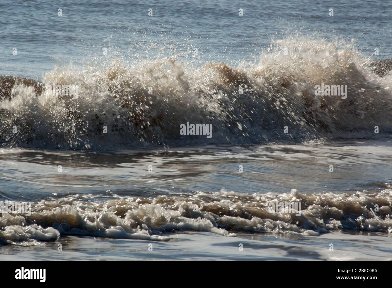 Ocean waves breaking at the beach Stock Photo - Alamy