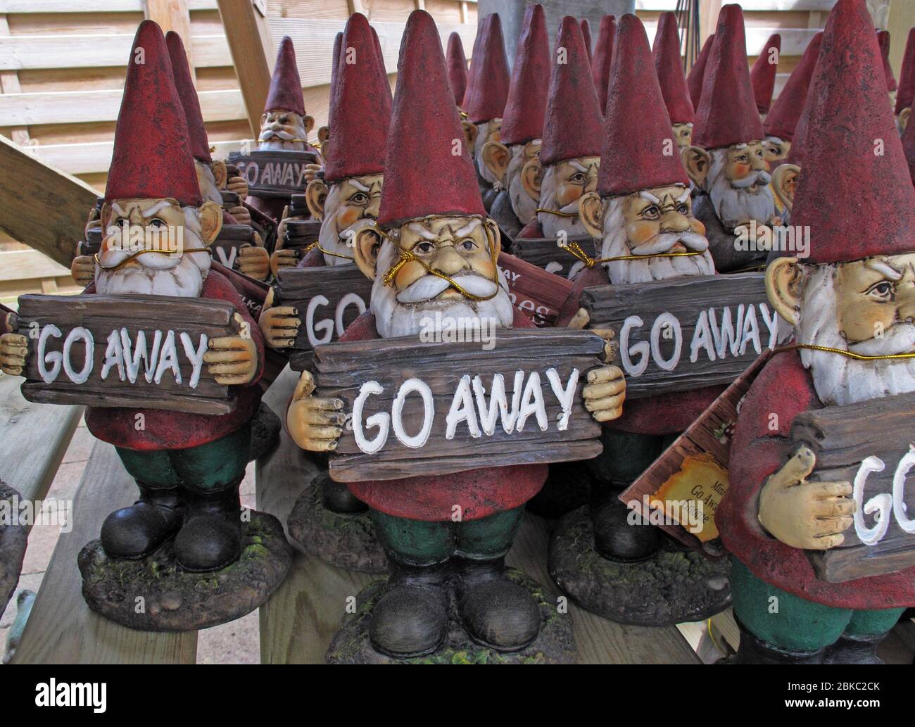 Go Away Xmas gnomes, garden centre antisocial attitude Stock Photo