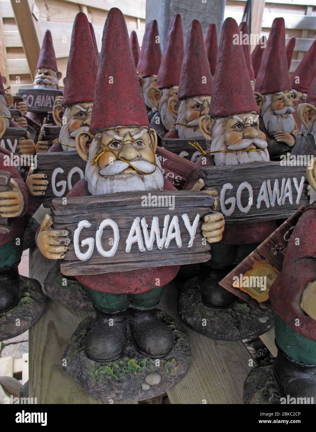Dozens of gnomes, with go away signs - A message to politicians ? Stock Photo