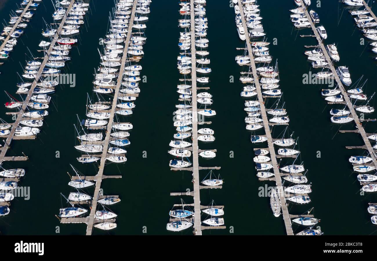 Largs, Scotland, UK. 4 May 2020. Aerial view of Largs Yacht Haven which is very busy with almost all berths being filled with yachts. Normally many yachts would be out sailing at this time of year but are now forced to remain at the harbour during the coronavirus lockdown. Iain Masterton/Alamy Live News Stock Photo