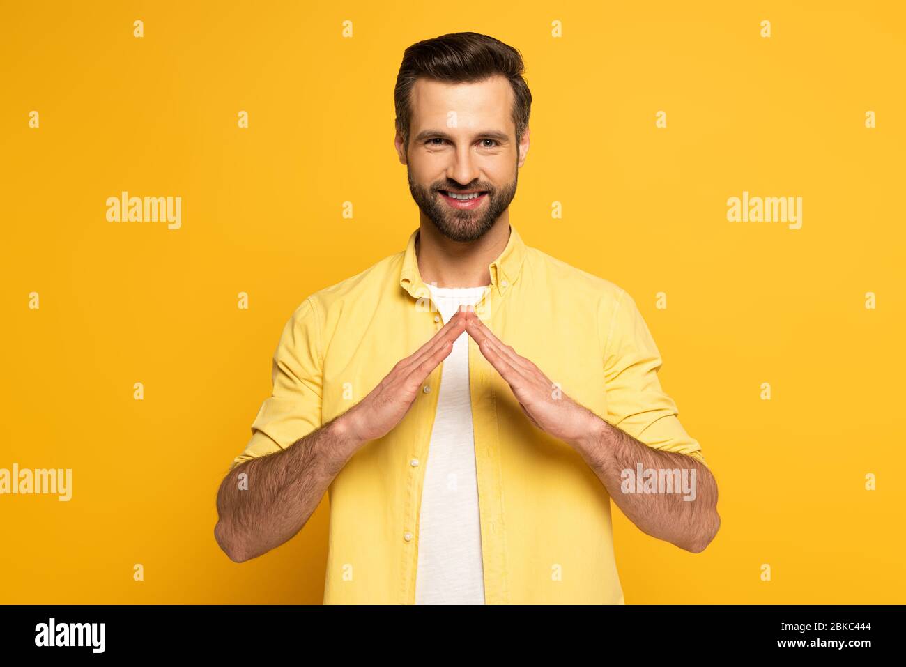 Hand Sign Language House Smiling man showing word house in sign language on yellow background ...
