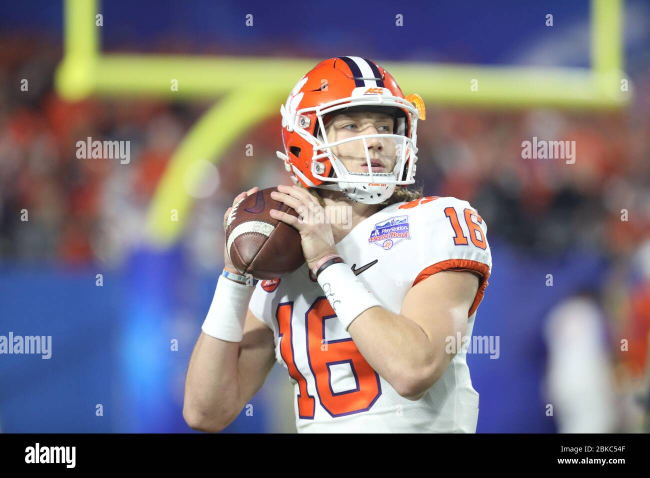 Trevor Lawrence, Clemson quarterback, throws a pass during the 2019 College Football Playoff semifinal showdown with Ohio State in the Fiesta Bowl. Stock Photo