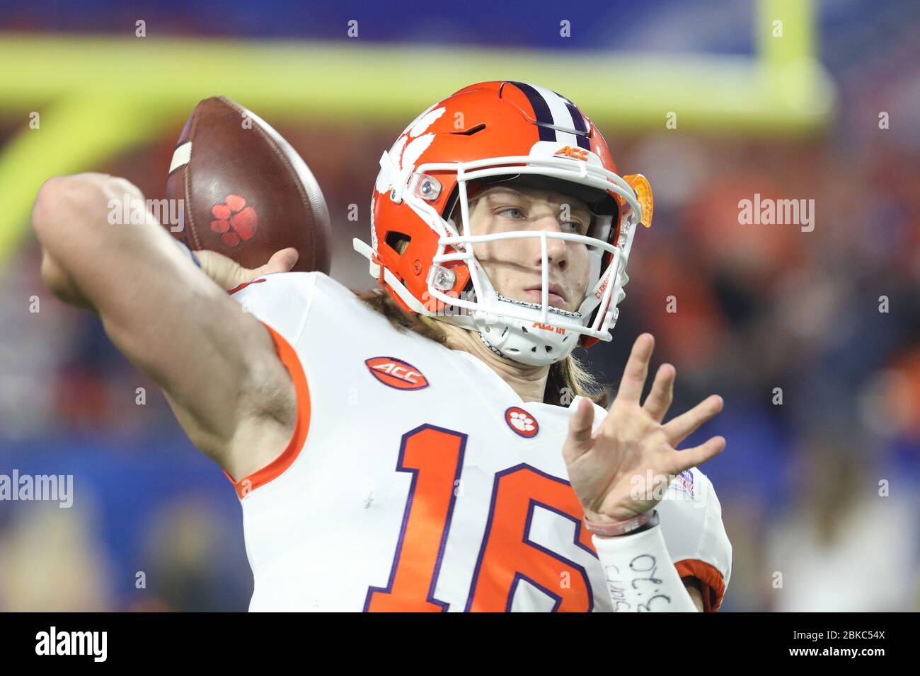 Trevor Lawrence, Clemson quarterback, throws a pass during the 2019 College Football Playoff semifinal showdown with Ohio State in the Fiesta Bowl. Stock Photo
