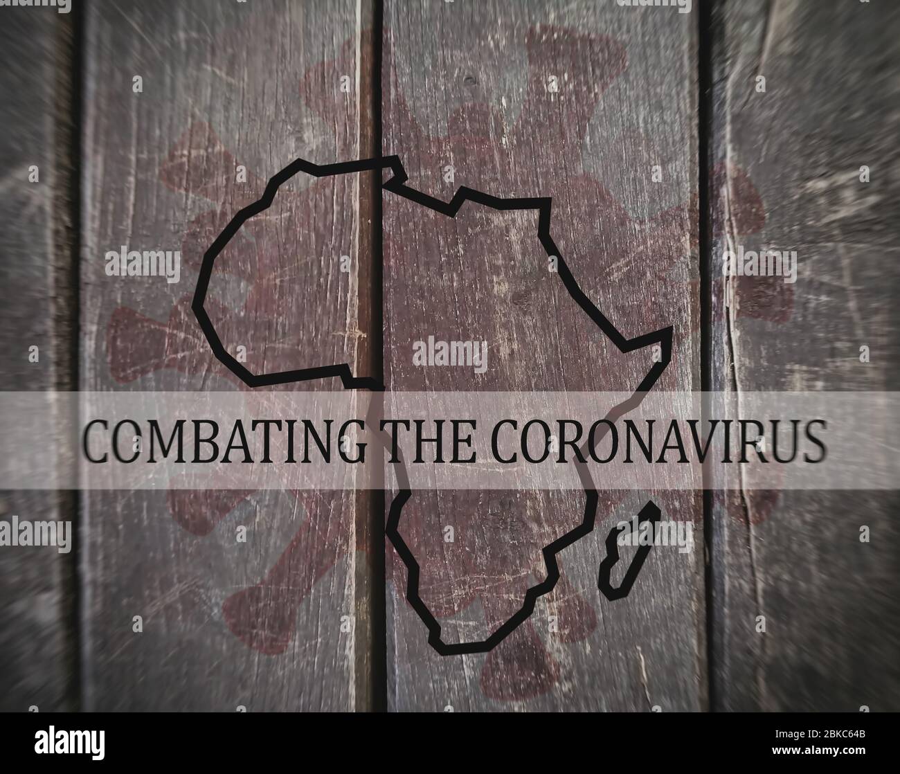 COMBATING THE CORONAVIRUS, Map of Africa on a dirty wooden background, blurred image. Stock Photo