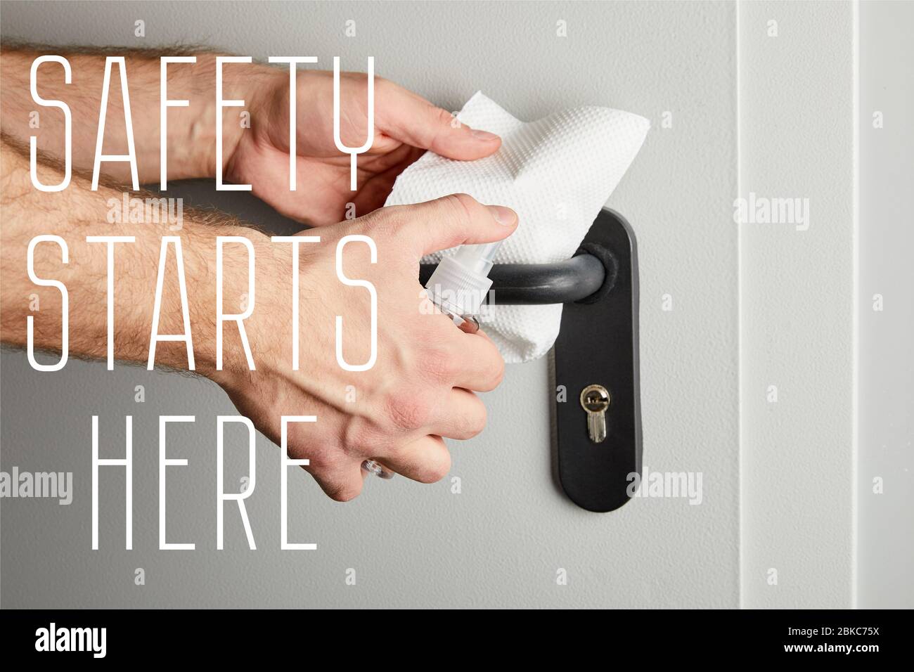 partial view of man disinfecting door handle with antiseptic and napkin