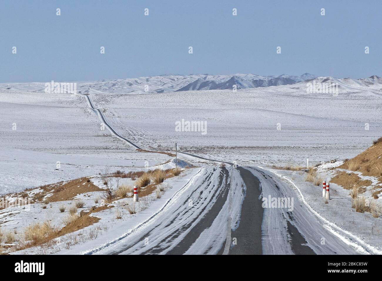 Mongolian road in a cold winter landscape Stock Photo