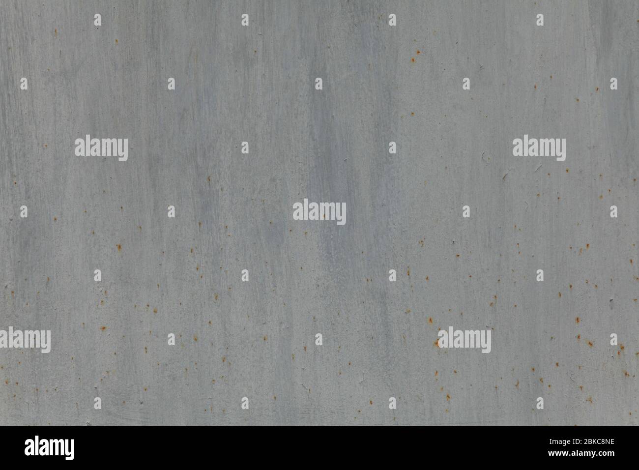 Metallic wall background, texture. Grey smooth painted surface with vertical strokes of paint and rusty dots. The wall and fence sketches Stock Photo