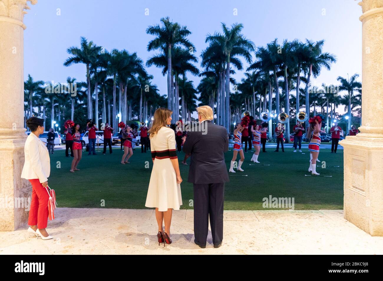 President Donald J. Trump and First Lady Melania Trump are entertained by members of the Florida Atlantic University marching band Sunday evening, Feb. 2, 2020, outside the Trump International Golf Club in West Palm Beach, Fla., prior to attending a Super Bowl party. President Trump and First Lady Melania Trump in Florida Stock Photo