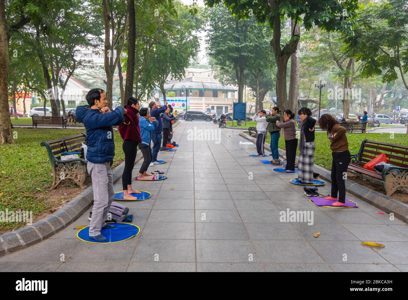 Group doing Falun Dafa, Ly Thai To Garden, Hoan Kiem district, Hanoi, Vietnam Stock Photo