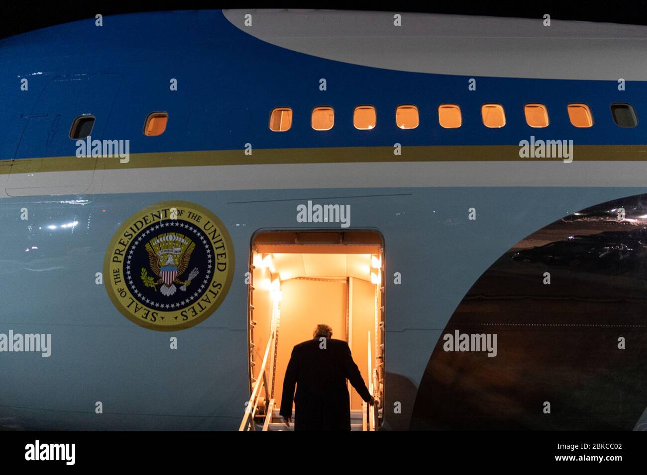President Donald J. Trump climbs the stairs to board Air Force One at Peterson Air Force Base in Colorado Springs, Colo. Thursday evening, Feb. 20, 2020, for his return flight to McCarran International Airport in Las Vegas. President Trump Departs Colorado Stock Photo
