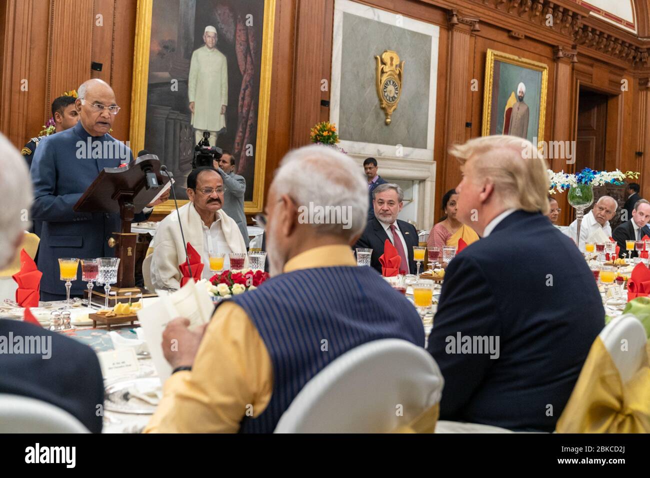 President Donald J. Trump listens as Indian President Ram Nath Kovind addresses his remarks Tuesday evening, Feb. 25, 2020, during a state dinner at Rashtrapati Bhavan, Presidehntial Palace in honor of President Trump’s and First Lady Melania Trump’s visit to India. President Trump and the First Lady in India Stock Photo