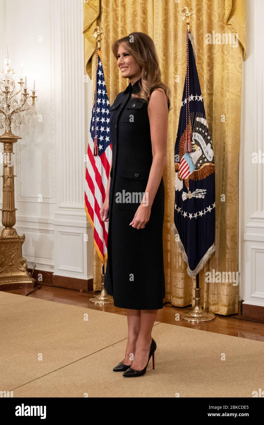 First Lady Melania Trump looks on as President Donald J. Trump delivers remarks at the African American History Month Reception Thursday, Feb. 27, 2020, in the East Room of the White House. African American History Month Reception Stock Photo