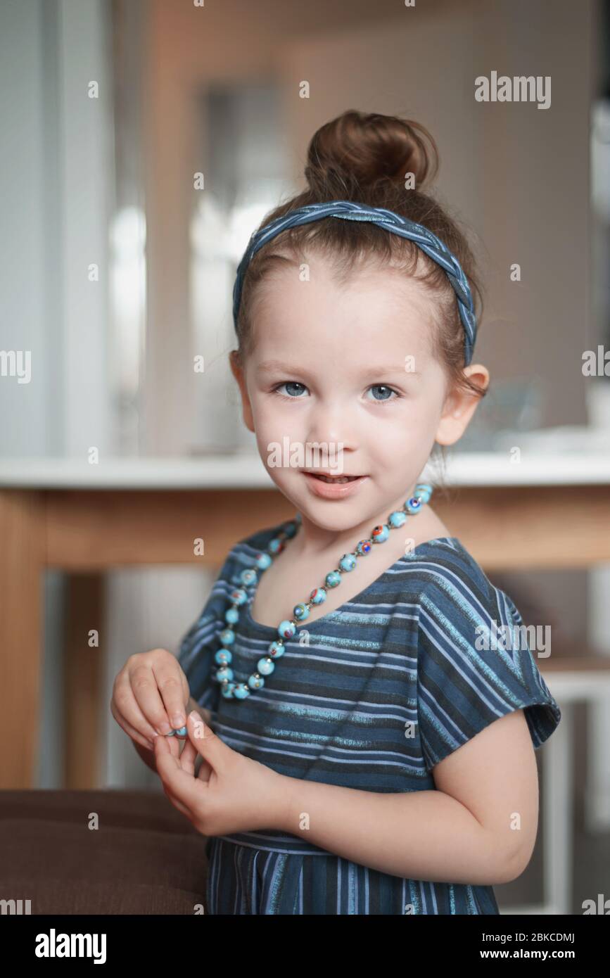 Adorable little girl in a blue dress Stock Photo - Alamy