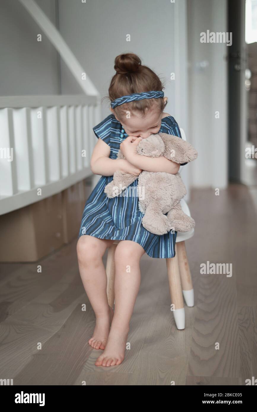 Adorable little girl in a blue dress Stock Photo - Alamy