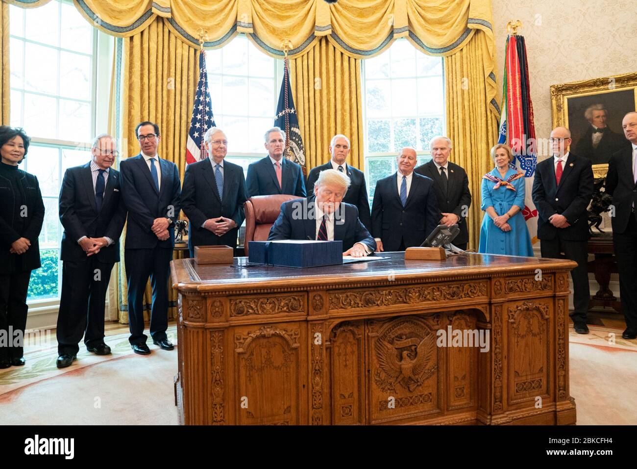 President Donald J. Trump and Vice President Mike Pence are joined by Senate Majority Leader Mitch McConnell; House Minority Leader Rep. Kevin McCarthy; Secretary of the Treasury Steven Mnuchin; Secretary of Agriculture Sonny Perdue; Secretary of Labor Eugene Scalia; Secretary of Transportation Elaine Chao; USTR Ambassador Robert Lighthizer;  Rep. Kevin Brady, R-Texas; Rep. Greg Walden, R-Ore.; Rep. Steve Chabot, R-Ohio; Assistant to the President and NEC Director Larry Kudlow; White House Director of Legislative Affairs Eric Ueland; White House Coronavirus Task Force Coordinator Ambassador De Stock Photo