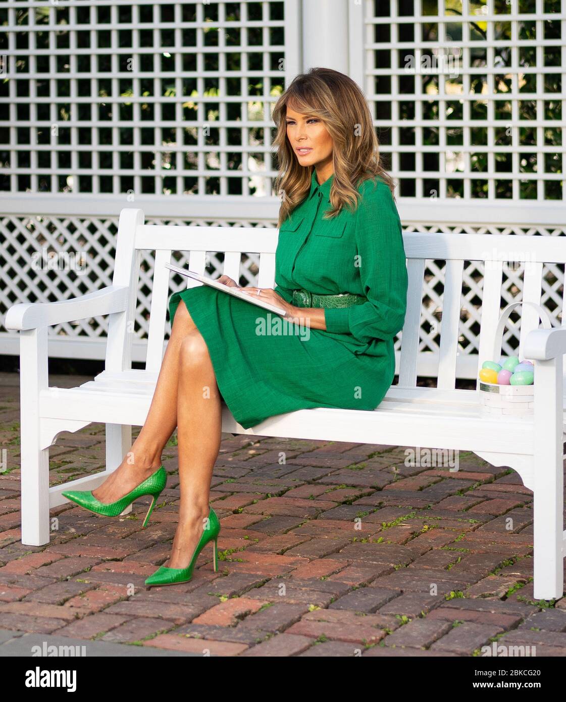First Lady Melania Trump reads the book “The Little Rabbit” by Nicola Killen during a video recording to be shared online with children for Easter Wednesday, April 8, 2020, in the Kennedy Garden of the White House. First Lady Melania Trump Records a Reading of 'The Little Rabbit' for Easter Stock Photo