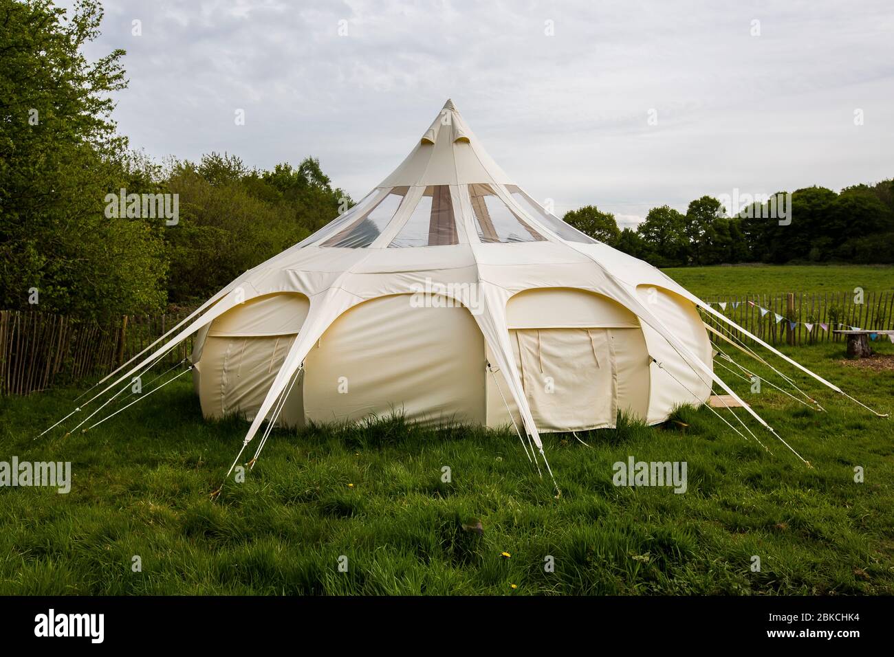 A Lotus Belle tent, a lotus flower shaped tent, one of the glamping options at Wowo's, a family campsite in Sussex Stock Photo