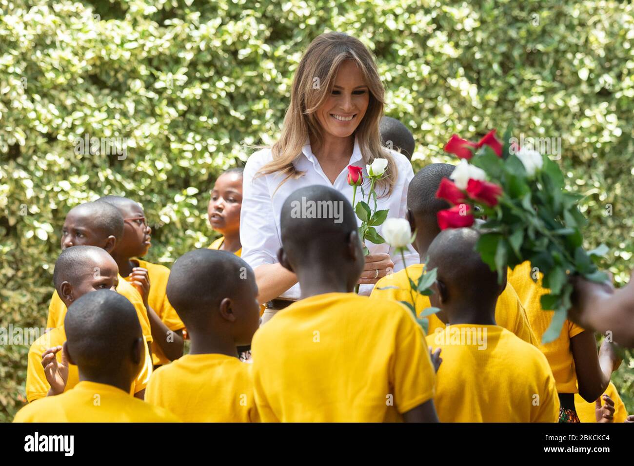 Schoolchildren sing as they hand First Lady Melania Trump roses Friday, Oct. 5, 2018, at The Nest: Children’s Home in Limuru, Kenya. First Lady Melania Trump's Visit to Africa Stock Photo