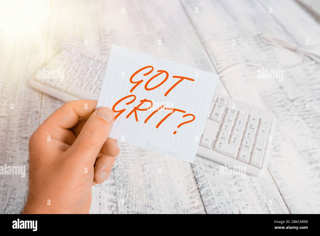 Word writing text Got Grit Question. Business photo showcasing A hardwork with perseverance towards the desired goal man holding colorful reminder squ Stock Photo