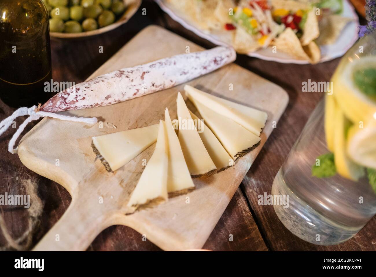 Mix of different snacks and appetizers. Spanish tapas on a wooden table ...