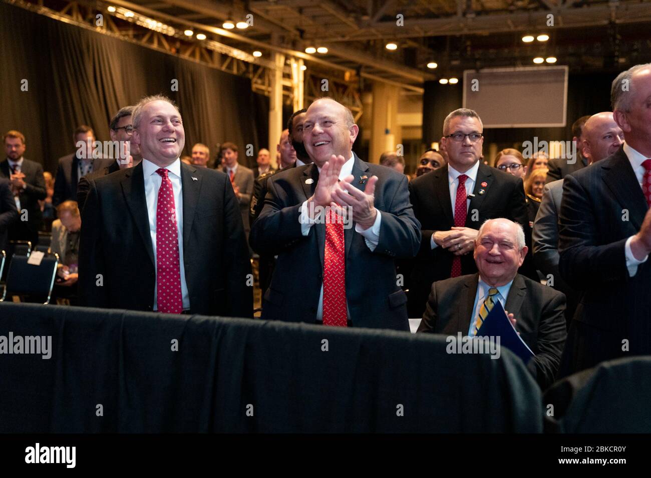 House Minority Whip Rep. Steve Scalise (R-LA), Zippy Duvall, the President of the American Farm Bureau Federation, and Secretary of Agriculture Sonny Perdue share a laugh with President Donald J. Trump during his remarks at the American Farm Bureau Federation’s 100th Annual Convention Monday, January 14, 2019, at the New Orleans Ernest N. Morial Convention Center, in New Orleans, Louisiana. President Trump Delivers Remarks in New Orleans Stock Photo