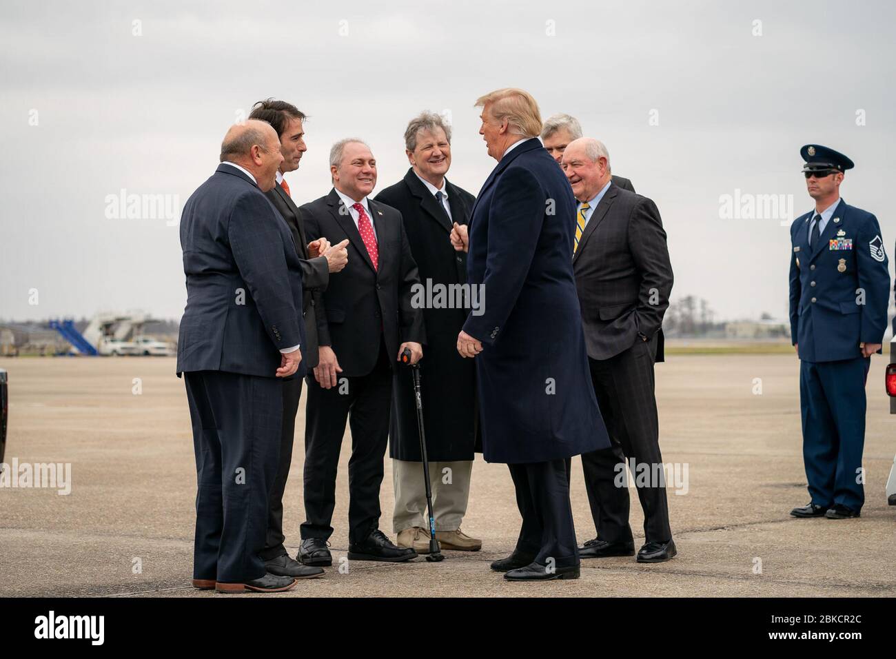 President Donald J. Trump arrives at Louis Armstrong New Orleans International Airport Monday, January 14, 2019, and is greeted by guests. From left, Zippy Duvall, the President of the American Farm Bureau Federation; Rep. Garrett Graves (R-LA); House Minority Whip Rep. Steve Scalise (R-LA); Senator John Kennedy (R-LA); Senator Bill Cassidy (R-LA); and Secretary of Agriculture Sonny Perdue. President Trump Arrives in New Orleans Stock Photo