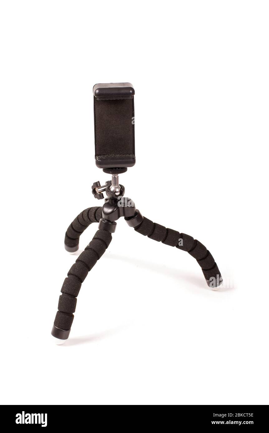 Adjustable universal smart phone tripod for remote recording and podcast isolated on the white background Stock Photo