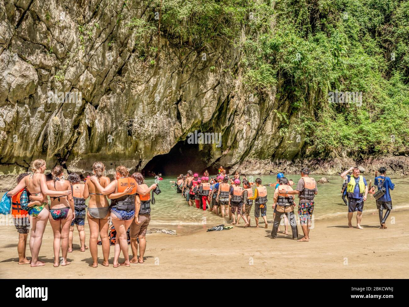 Mass tourism of Asian Tourist Groups at Emerald Cave (Tham Morakot), Thailand Stock Photo