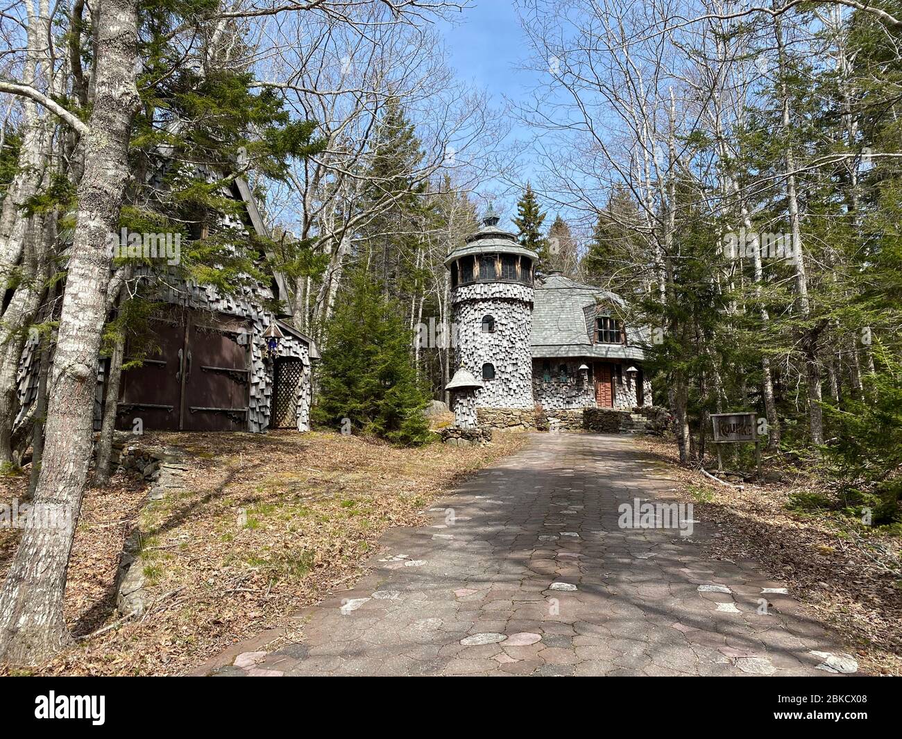 This photo, taken in April of 2020, shows the “Mushroom House” in East Boothbay, Maine. The house was designed and built in 1998 by David Lee.  Lee has built 25 Middle Earth style homes from scratch, by himself, since 1975. Stock Photo