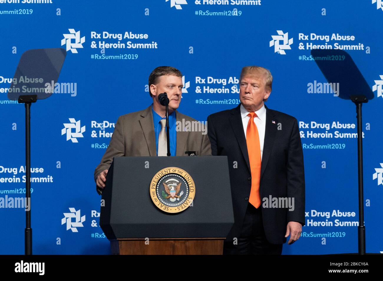 President Donald J. Trump listens as Virginia State Police Senior Special Agent Ervin Thomas Murphy speaks about his son Matthew Jason Murphy who died of an opioid overdose, during his remarks at the Rx Drug Abuse and Heroin summit Wednesday, April 24, 2019, at the Hyatt Regency Atlanta. The Rx Drug Abuse and Heroin Summit Stock Photo