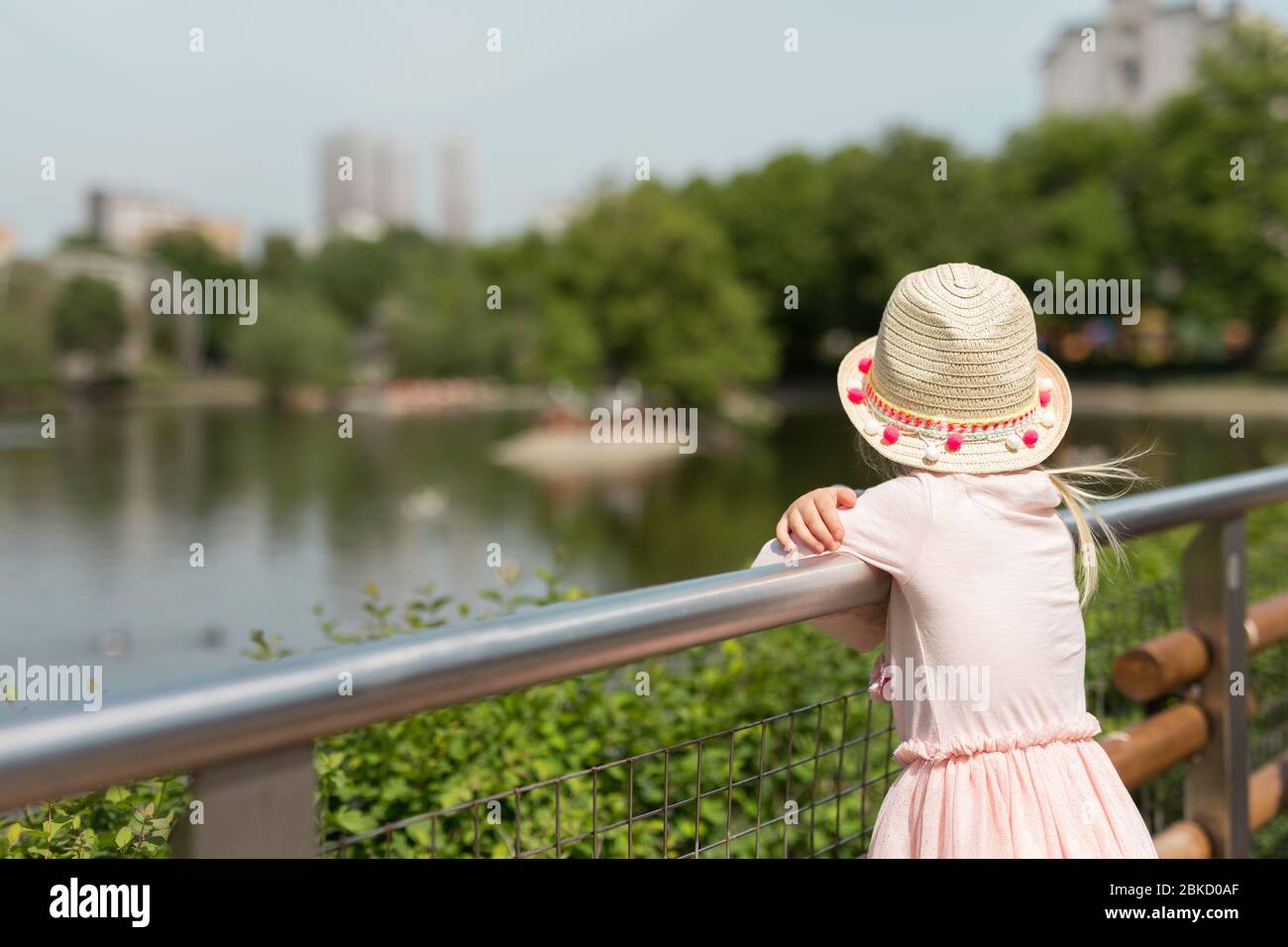 Rear view toddler walking park hi-res stock photography and images - Alamy