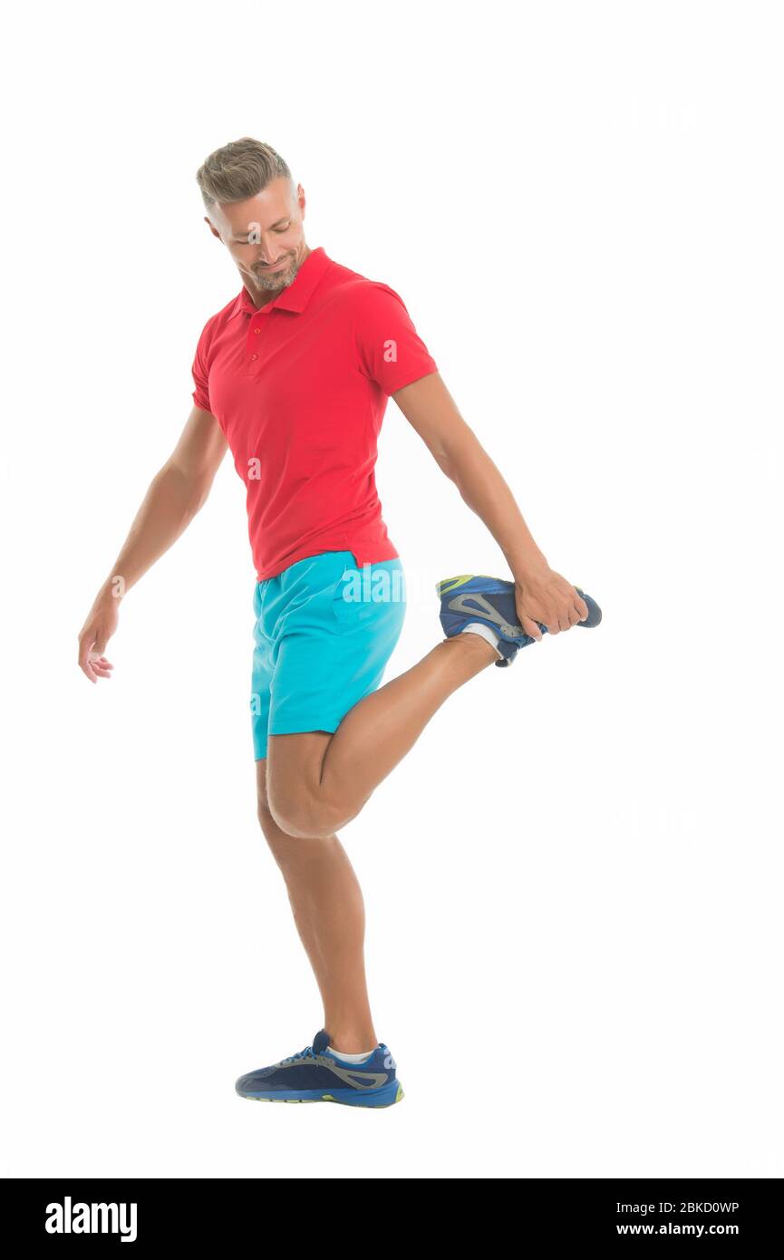 Warming up with some stretches. Athletic man stretching isolated on white. Muscle stretching. Stretching workout routine. Stretching exercises for better flexibility. Preventing injury Stock Photo Ala...