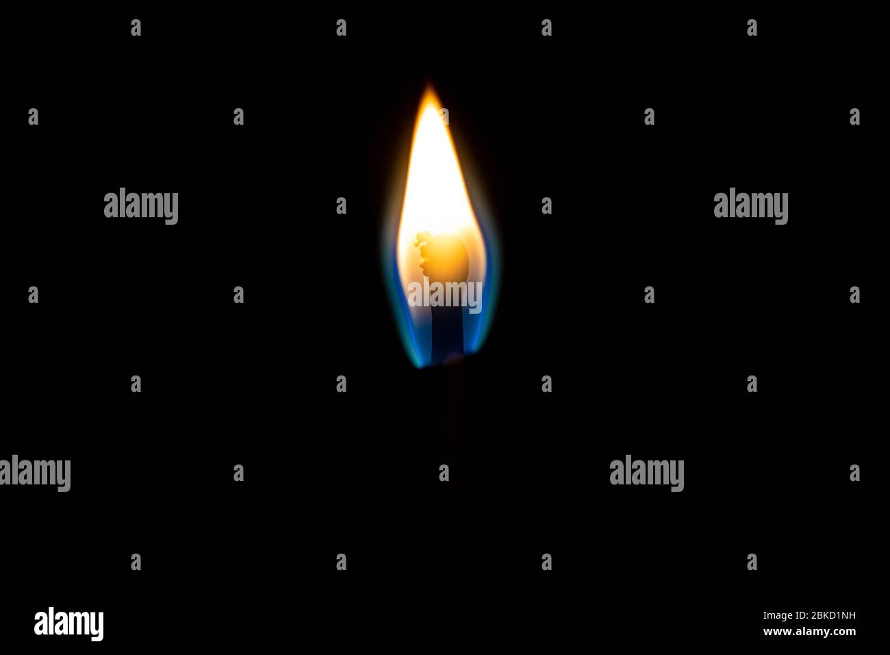 Burning match lighting flame isolated on a black background Stock Photo