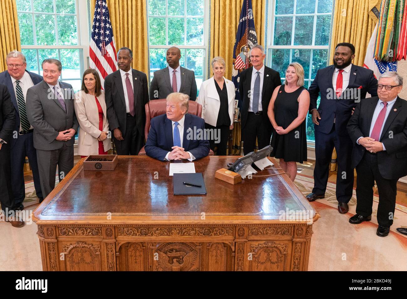 President Donald J. Trump signs an Executive Order on establishing a White House Council on Eliminating Regulatory Barriers to Affordable Housing Tuesday, June 25, 2019, in the Oval Office of the White House. President Trump Signs an Executive Order on Affordable Housing Stock Photo