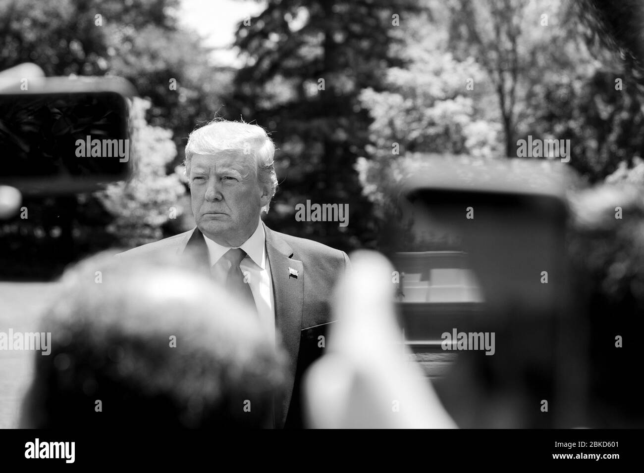 President Donald J. Trump talks to members of the press on the South Lawn of the White House Tuesday, July 30, 2019, following his trip to Williamsburg, Va. (Courtesy Photo by Caleb Spencer) President Trump on the South Lawn Stock Photo