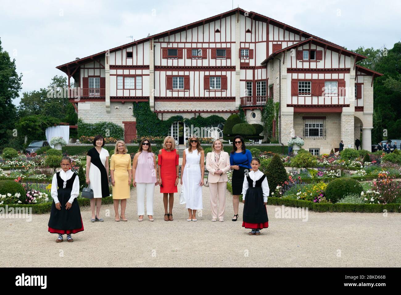 First Lady Melania Trump takes a family photo with the spouses of G7 leaders during a tour of Villa Arnaga Sunday, Aug. 25, 2019, in Cambo-les-Bains, France. From left, 10 year-old Enea Amorena; Mrs. Akie Abe, wife of Prime Minister of Japan Shinzo Abe; Mrs. Malgorzata Tusk, wife of European Council President Donald Tusk; Mrs. Jenny Morrison, wife of Prime Minister of Australia Scott Morrison; Mrs. Brigitte Macron, wife of President Emmanuel Macron of France; Mrs. Maria Cecilia Morel Montes, wife of President Sebastian Pinera of Chile; Mrs. Adele Malpass, wife of President of World Bank David Stock Photo