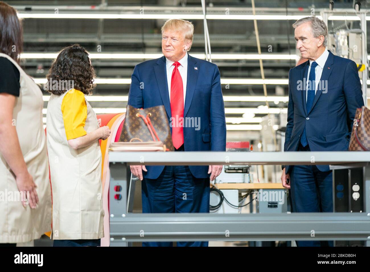 President Donald J. Trump visits and speaks with workers, as he is joined  by Bernard Arnault, CEO of LVMH Moet Hennessy; Carlos Sousa the general  manager of Louis Vuitton Manufacturing USA, and