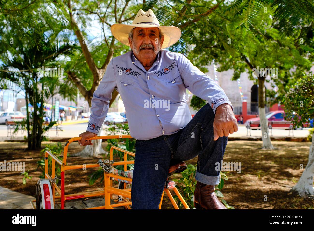 Portrait of a middle-aged cowboy, dressed in an embroidered shirt and typical hat, in Tizmin Square. Stock Photo