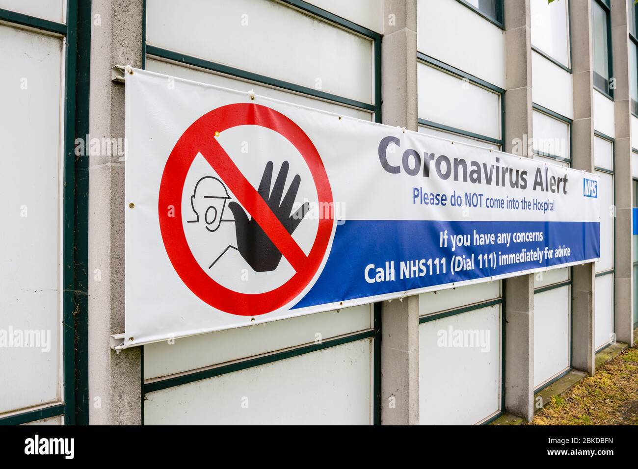 Banner sign outside Ashford hospital in Stanwell, Hounslow with a Coronavirus Alert request not to enter the hospital Stock Photo