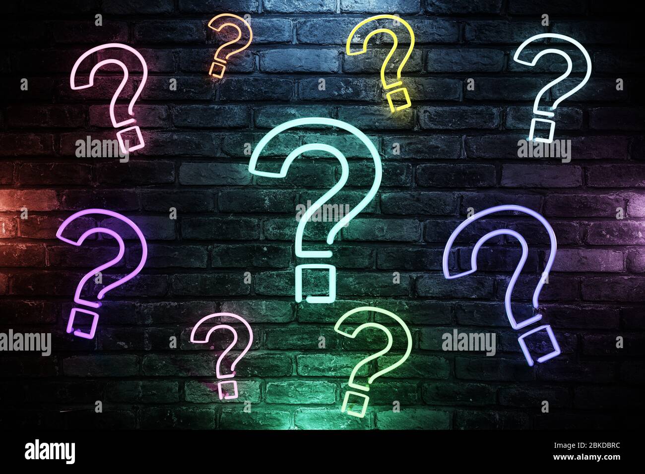 Many 3D illustrated question mark with led light on brick wall background  Stock Photo - Alamy