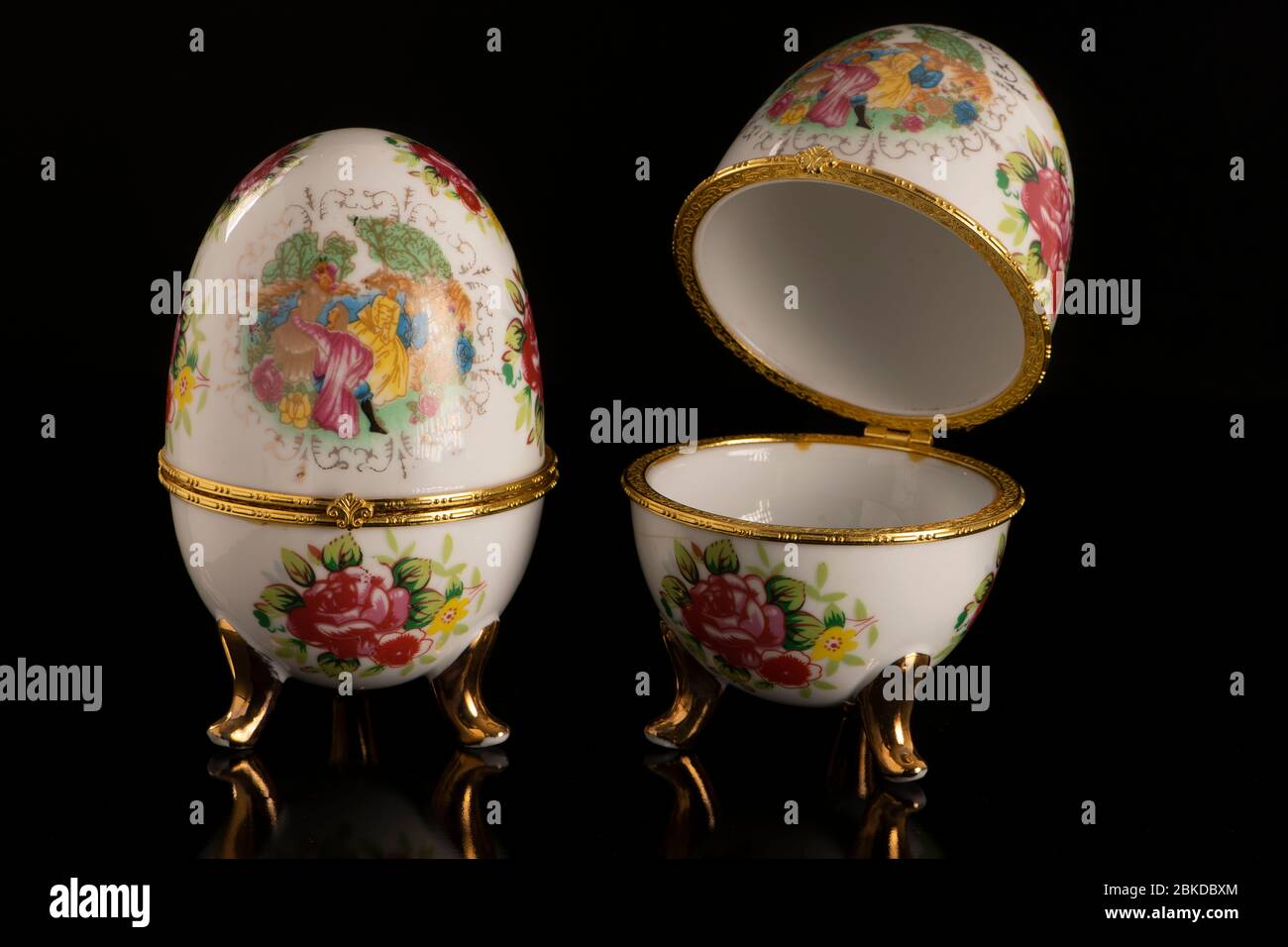 Jewelery Faberge eggs on a black table and a black background Stock Photo