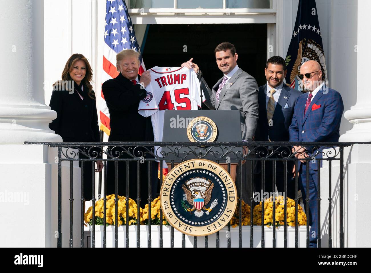 Nationals first baseman Ryan Zimmerman, joined by First Lady Melania Trump, Nationals Manager Dave Martinez and Nationals General Manager Mike Rizzo, presents President Donald J. Trump with a Nationals jersey on the Blue Room Balcony of the White House Monday, Nov. 4, 2019, during the celebration of the 2019 World Series Champions, the Washington Nationals on the South Lawn. President Trump Welcomes the Washington Nationals to the White House Stock Photo