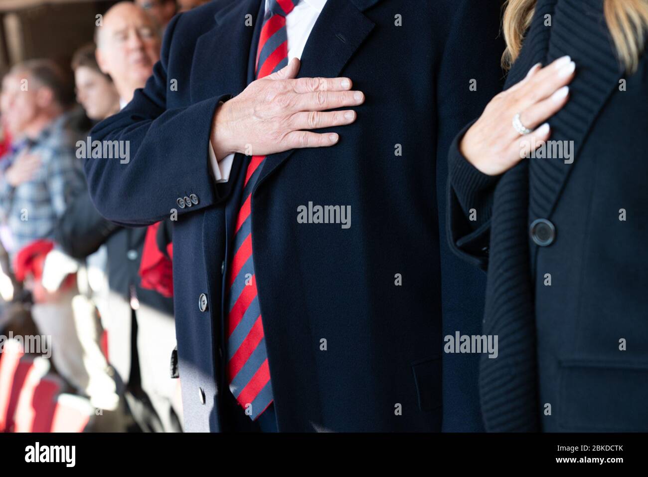President Donald J. Trump and First Lady Melania Trump hold their hands to their hearts at Bryant-Denny Stadium Saturday, Nov. 9, 2019, while attending the University of Alabama -Louisiana State University football game in Tuscaloosa, Ala. President Trump and First Lady Melania Trump in Alabama Stock Photo