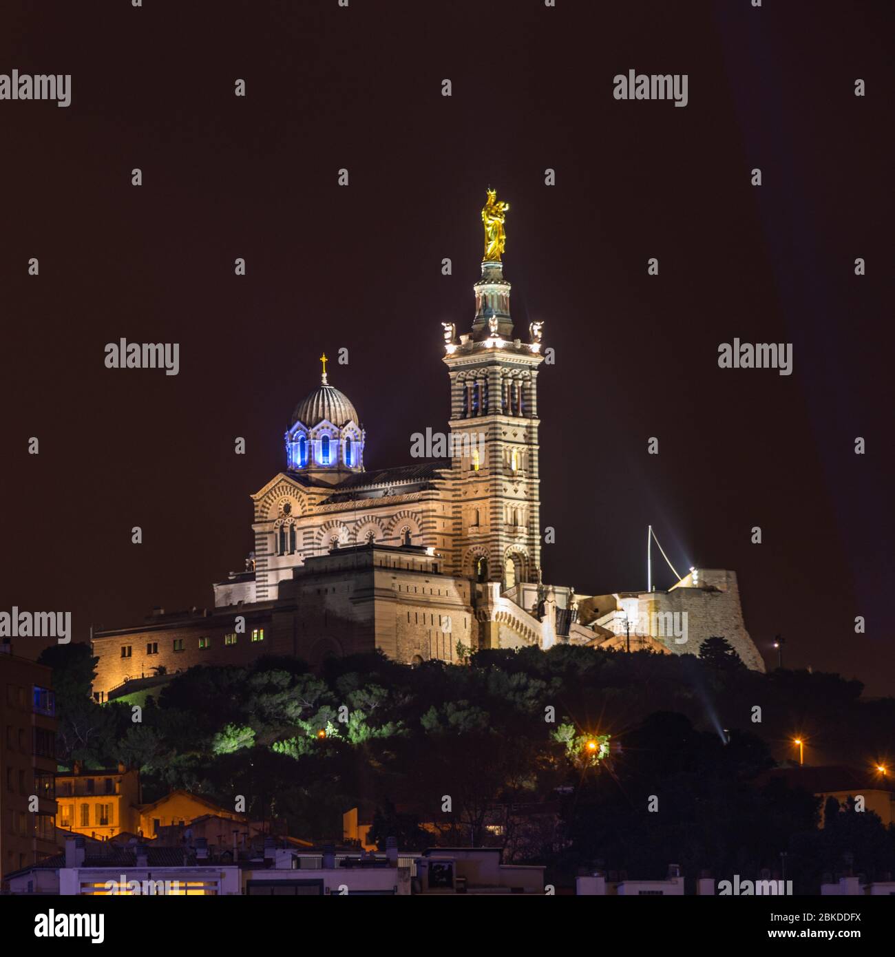 The basilica of Notre Dame de la Garde seen from Marseille Vieux Port (old port) at night, France Stock Photo