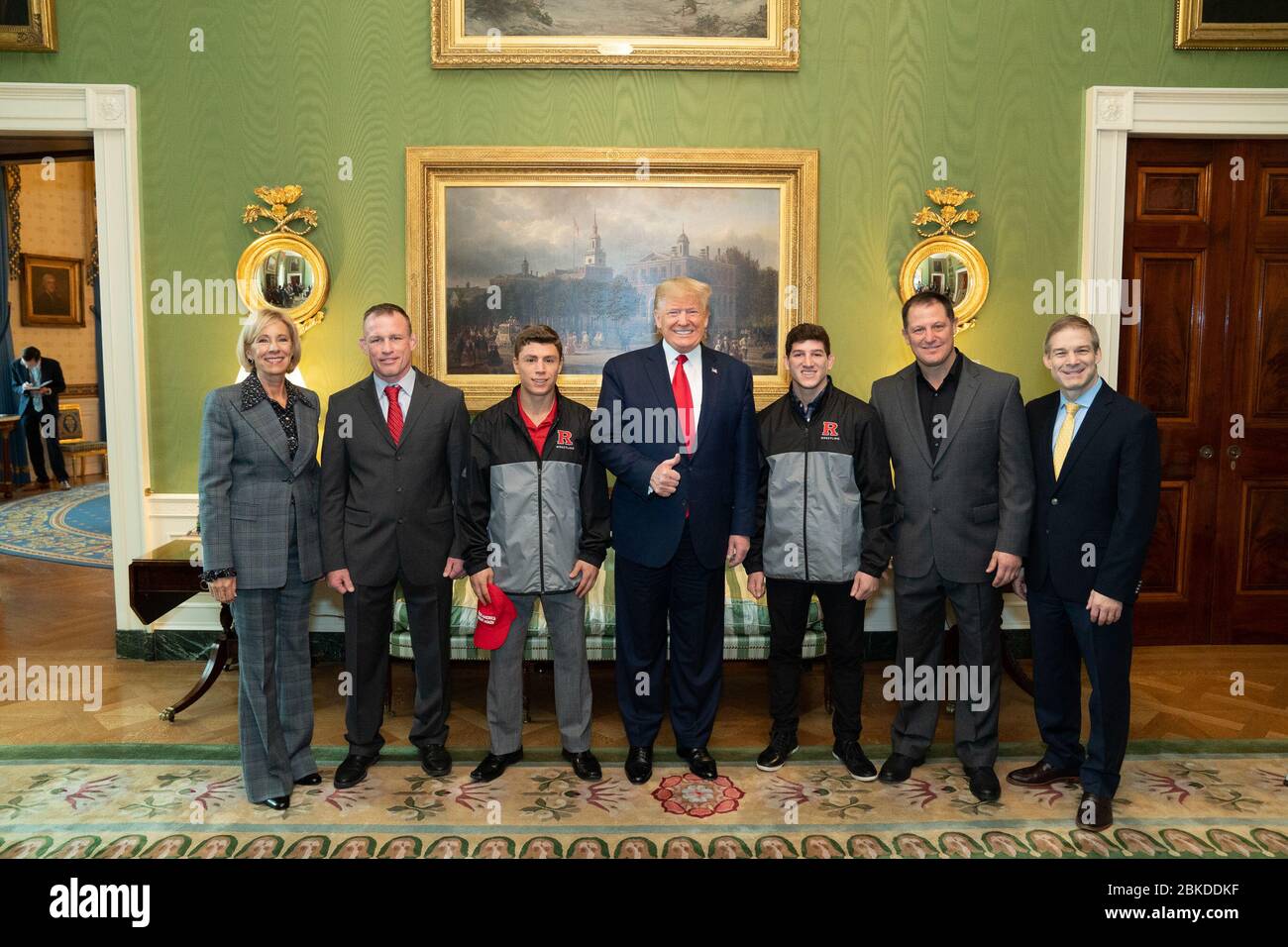 President Donald J. Trump poses with members of the 2019 NCAA Rutgers University Men’s Champion Wrestling team Friday, Nov. 22, 2019, during the NCAA Collegiate National Champions Day in the Green Room of the White House. President Trump Greets NCAA National Champions Stock Photo