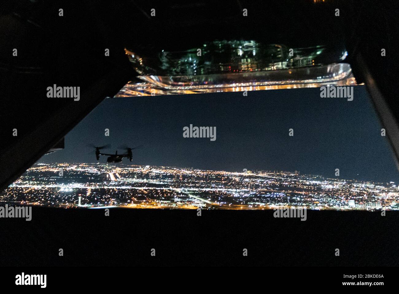 Military aircraft carrying White House support staff fly above the Palm Beach, Fla. area Tuesday evening, Nov. 26, 2019,after leaving Palm Beach International Airport in Palm Beach, Fla. President Trump Arrives in Florida Stock Photo