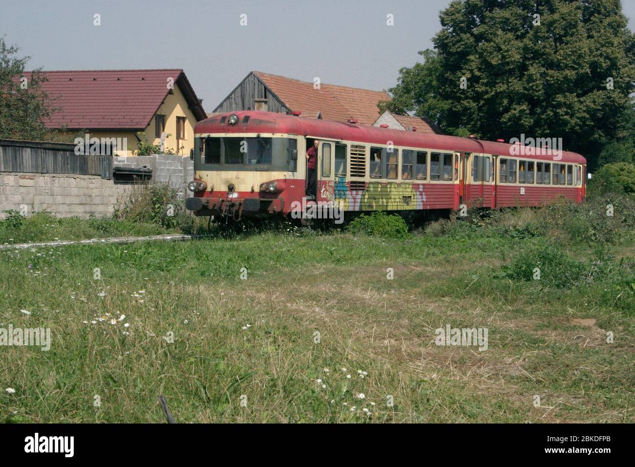 Two-car passenger train in Romania's countryside Stock Photo